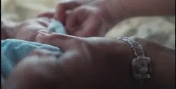 Close-up of two hands resting together.